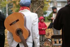 guitar slung over a musician's back