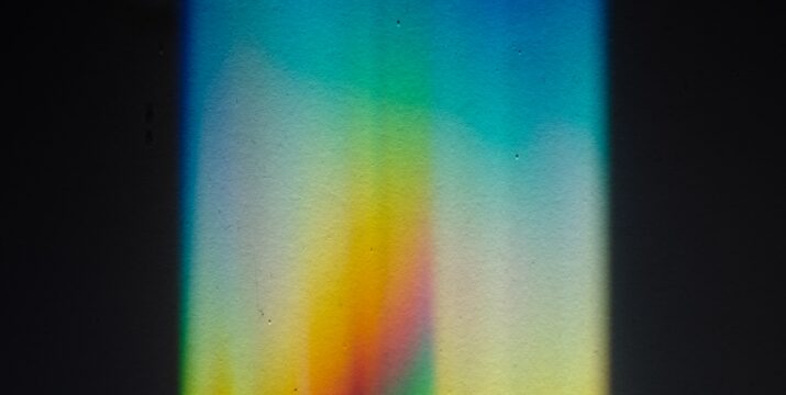 An picture of a vertical spectrum of coloured lights.