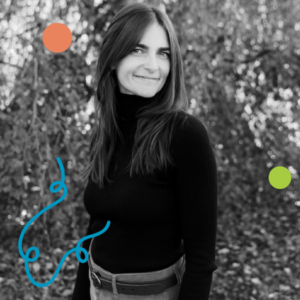 Photo of Georgia Simms standing against a backdrop of trees with autumn leaves. Image has been filtered in greyscale with colourful dots and a squiggly line added.