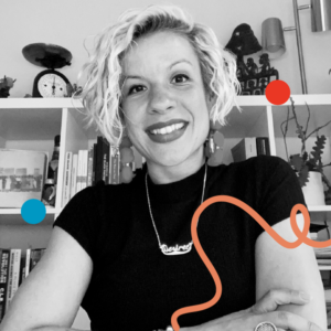 A head and shoulders photo of Désirée Rochat seated with arms folded and smiling down at the camera. Behind her is a bookshelf. Image is filtered in greyscale with colourful dots and a squiggly line added.
