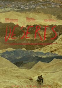 Poster for Déserts (2016) by Charles-André Coderre and Yann-Manuel Hernandez. Red stylized text provides the film title and credits against a photo of mountainous desert terrain stretching into the distance, with two people seated on the peak in the foreground.