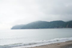 Foggy photo of the scenic coastline of Coin-du-Banc, taken from the beach.