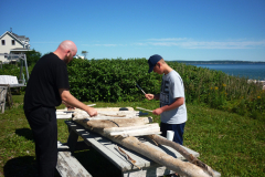 Playing a driftwood xylophone at MILE camp.