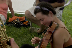 MILE camper playing violin.